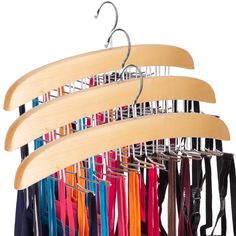 several pairs of umbrellas hanging on a rack with clothes hangers attached to them