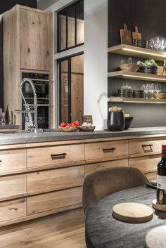 the kitchen is clean and ready to be used for dinner or wine tasting in someone's home