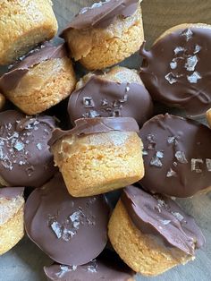 a pile of chocolate covered cookies sitting on top of a table