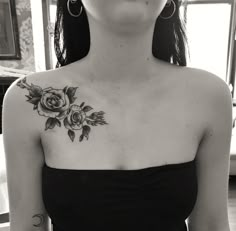 a woman with a rose tattoo on her chest