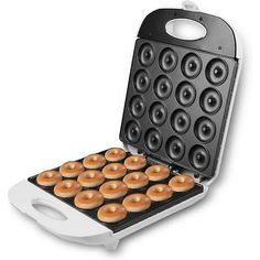 an electric donut maker with twelve doughnuts in it's pancake tray