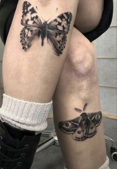 a woman's legs with butterfly tattoos on her leg and the bottom part of her thighs