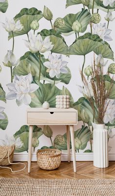 the wallpaper in this room is painted with water lilies and green leaves on it