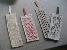 three crocheted toothbrush holders sitting next to each other on top of a table