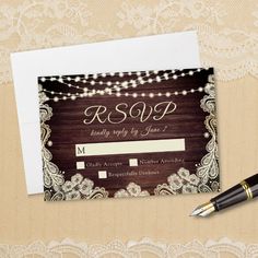 wedding rsp card with pen on top of it next to lace and wood background