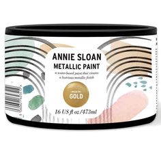 an open can of metallic paint with gold and pinks on the bottom, against a white background