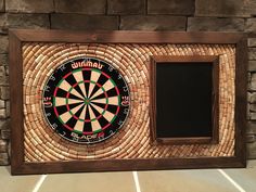 a wooden frame with a dart in it