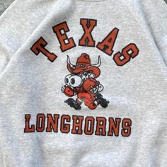 Vintage Ncaa Texas Longhorns Shirt, Texas Longhorns Sweatshirt, University Of Texas Shirt, Shirt For Men Women, College Sweatshirt Product Information Promise That You Will Get The Best Products We Have. With Variety Of T Shirts Styles, Sizes And Colors. Product Sizing/Fit T-Shirts: Run True To Size But Please Note They Are Unisex Shirts Which May Be Larger Than A Than A Typical Fitted Women’s Size Shirt. Our Typical Suggestion Is For Woman To Size Down For A Tighter Fit And For Men To Size Up F Retro Embroidered Graphic Tops For Fall, Retro Embroidered Tops For Fall, Retro Tops With Embroidered Graphics For Winter, Retro Winter Fan Merchandise Tops, Texas Crewneck Sweatshirt, Texas Southern University Shirts, Vintage College Sweatshirts, Texas Longhorns Shirts, Texas Longhorns Sweatshirt