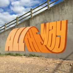 graffiti on the side of a concrete wall