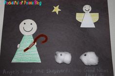 a child's artwork made out of felt and paper with an angel, sheep, and star on it