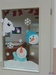 there is a snowman and polar bear in the window