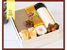 an open gift box filled with assorted items