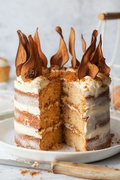 a cake that has been cut in half on a plate with one slice taken out