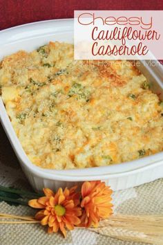 cheesy cauliflower casserole in a white dish with flowers on the side