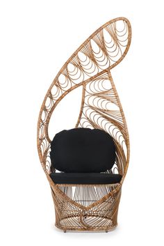 the chair is made out of wicker and has a black cushion