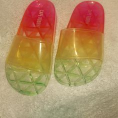 Clear Multicolored Sandals Never Worn Summer Slip-on Slides With Translucent Outsole, Casual Slides For Summer Parties, Casual Party Slides For Summer, Casual Summer Party Slides, Multicolor Slip-on Slides For Summer, Summer Translucent Outsole Open Toe Jelly Sandals, Summer Jelly Sandals With Translucent Outsole And Round Toe, Summer Jelly Sandals With Translucent Outsole And Open Toe, Trendy Jelly Sandals With Translucent Outsole For Beach