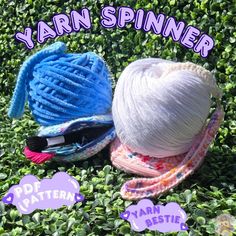 two balls of yarn sitting on top of some green grass with the words yarn spinner next to them