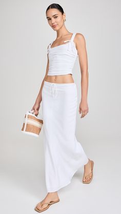 Find NIA Thyme Skirt on Editorialist. Fabric: Lightweight, non-stretch weave. Covered elastic waist with drawstring. Shell: 70% viscose/30% linen. Lining: 95% polyester/5% spandex. Hand wash. Imported, China. Measurements: Measurements from size XS Length: 39.25in / 100.0cm Summer Relaxed Fit Rayon Maxi Skirt, Summer Day Out Maxi Skirt, Summer Rayon Maxi Skirt For Day Out, Summer Rayon Lined Maxi Skirt, Summer Rayon Maxi Skirt, Cotton Maxi Skirt With Drawstring, Cotton Maxi Skirt With Drawstring And Relaxed Fit, Chic Gathered Maxi Skirt For Summer, Summer Viscose Maxi Skirt