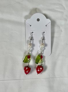 Strawberry Fruit Beaded Dangle Earrings Jewelry Multicolored Trendy Dainty Cottage Core Coquette Earrings Beautiful Glass Bead Earrings These strawberry fruit beaded dangle earrings are made with pearls, glass beads crystal beads, and nickel-free hardware and coated in tarnish-resistant sealant. These pair beautifully with the strawberry choker necklace, available here: Please don't hesitate to reach out if you have any questions! Casual Dangling Beads Jewelry As Gift, Casual Dangle Earrings With Colorful Beads, Casual Beaded Dangle Earrings As Gift, Casual Colorful Beaded Earrings For Gift, Casual Colorful Beaded Earrings As Gift, Strawberry Choker, Coquette Earrings, Glass Bead Jewelry, Glass Bead Earrings