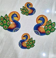 four peacocks painted on white marble with green and orange feathers in the center, surrounded by leaves