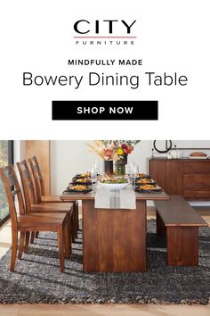 a dining room table with chairs and place settings