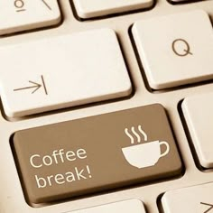 a keyboard with a coffee break sticker on it's key board and an arrow pointing to the left