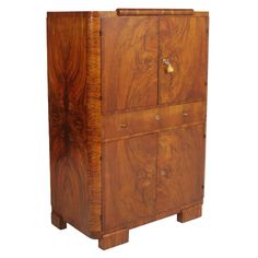 a wooden cabinet with four doors and two drawers on one side, the door is open