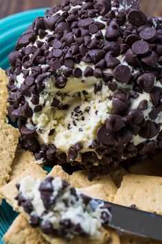 chocolate chip ice cream sandwich on top of crackers with a knife in the middle