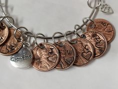 Pennies from. Heaven charm bracelet. Customized with the date and initial of the corresponding family members Pennies From Heaven, Charm Necklaces, Alex And Ani Charm Bracelet, Family Members, Arm Band, Charm Necklace, Mother's Day Gifts, Penny, Mothers Day