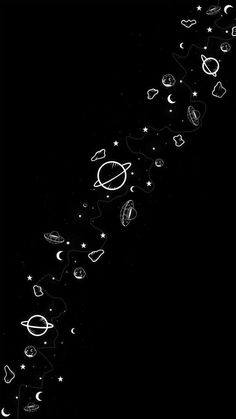 an abstract black and white photo with stars, planets, and other objects in the sky