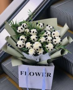 a bouquet of flowers is sitting on the ground