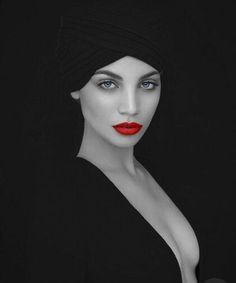 a mannequin wearing a black dress with red lipstick and a turban