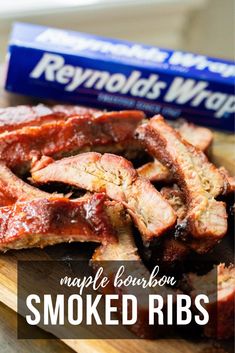 pork ribs on a cutting board next to a barbeque wrapper with text reading maple bourbon smoked ribs