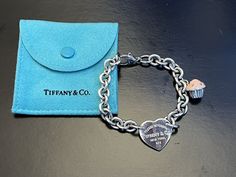 Tiffany & Co ‘Return to Tiffany’ Heart Tag Silver Bracelet with discontinued Tiffany & Co Silver Cupcake Charm. Pristine Condition. Original box and bag. 7.5 inches in length. Silver Cupcakes, Cupcake Charms, Return To Tiffany, Heart Tag, Tiffany And Co, Fine Jewelry Bracelets, Tiffany Heart, Bracelets And Charms, Heart Bracelet