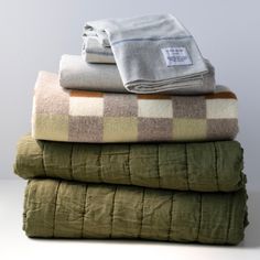 three blankets stacked on top of each other