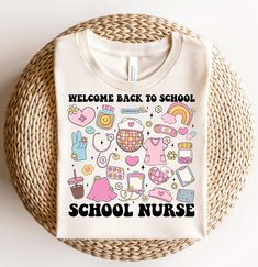 a t - shirt that says welcome back to school, with various items on it