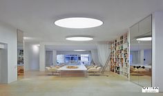 a long table in the middle of a room with bookshelves on both sides