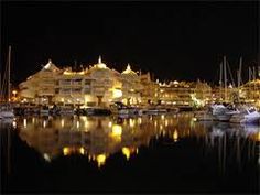 a harbor filled with lots of boats at night