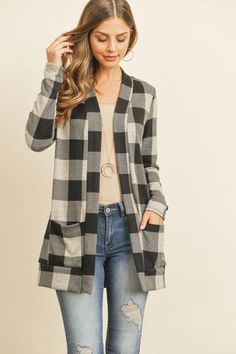 Plaid Love || Customer Favorite Available in Red, Hunter Green, and Oatmeal buffalo plaid Open front long sleeve cardigan sweater Medium weight brushed flannel fabric Fits true to size Slight stretch 97% Polyester, 3% Spandex Measurements approximately: Small: Bust 36", Length 29" Medium: Bust 40", Length 30" Large: Bust 44", Length 31" X Large: Bust 48", Length 32" Buffalo Plaid Cardigan, Jeans And Combat Boots, Red Hunter, Pattern Cardigan, Plaid Cardigan, Patterned Cardigans, Open Cardigan, Long Sleeve Cardigan, Buffalo Plaid