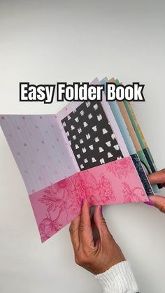 a person is holding an easy folder book in front of their face with the words easy folder book on it