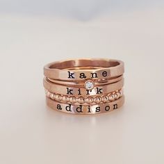 Rose Gold Filled Name Ring Set Mother's Day Gifts, Mom Rings, Rose Gold Filled Name Rings, Set of Rings, Mother Rings These rings are handmade in our Indiana studio. Each engraved ring starts from a spool of wire. They are handcut, handformed and soldered in the first process of creating your ring. They are then hammered to size, engraved, handbrushed, and polished. Each ring will have a small solder spot in the back because they are handmade, not machine made. We use yellow gold solder on our y Names Jewelry, Mom Rings, Personalized Stackable Rings, Mom Jewelry Personalized, Children Names, Stackable Ring Sets, Gifts Mom, Mom Ring, Unique Gifts For Mom