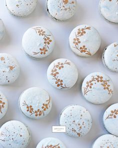 an image of some white and gold macaroons