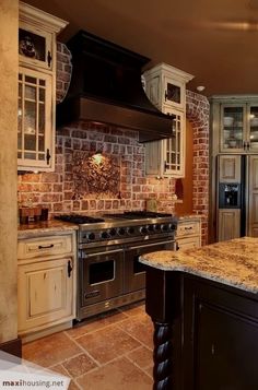 a kitchen with marble counter tops and an oven