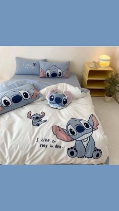 an image of a bed with cartoon characters on it