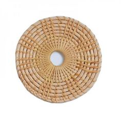 a round rattan placemat made out of wood and woven with an oval hole in the middle