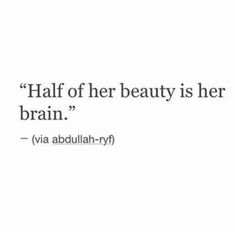 a quote on the side of a wall that says half of her beauty is her brain