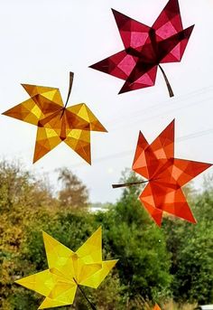 four colorful kites are flying in the air