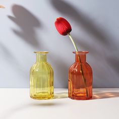 Beauty comes in all shapes and sizes, as our Sylvie Glass Flower Vases clearly demonstrate. Spice up your décor by adding vases that command attention with their texture, color and silhouette. These pretty glass vases are designed to be unique, yet to effortlessly complement each other. Each vase is organically shaped and boasts natural curves, color and eye-catching patterns. Group them together for a delightful tablescape or use them individually to liven up a bookcase, coffee table, side tabl Romantic Vase, Rose Texture, Vase Orange, Flower Vase Making, Glass Flower Vase, Orange Texture, Pink Texture, Glass Flower Vases, Wedding Vases