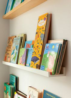 children's books are lined up on the shelves