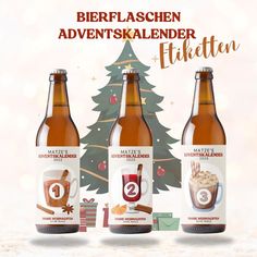 three bottles of beer sitting next to each other in front of a christmas tree and snow covered ground